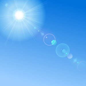 蓝蓝的天空太阳和镜头光晕照片