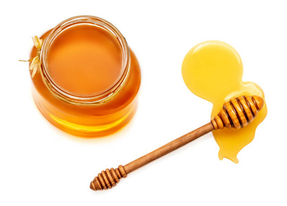 蜂蜜和蜂蜜在罐子被隔绝在白色背景。天然蜜蜂蜂蜜。顶部视图