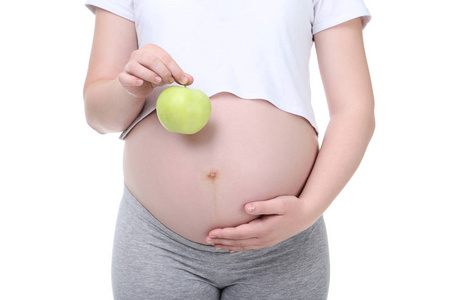 白色背景的绿色苹果的孕妇