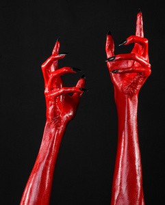 红魔鬼手,红色的手的撒旦,万圣节主题,黑色背景,孤