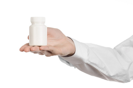 医疗主题 拿白空罐在白色背景上药的医生的手