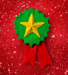橡皮泥绿色奖牌横幅与星照片