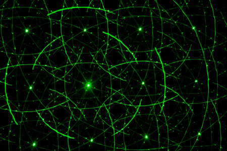 用绿色激光画在黑色墙上。抽象绘图