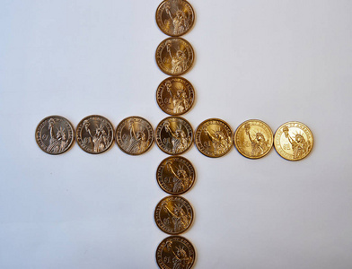 设计元素。直十字的黄色闪光硬币一美元。从上面查看。在白色背景上