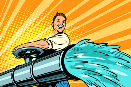 灌溉和农业.一个人用清水打开管子.照片