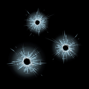 在玻璃上的弹孔照片