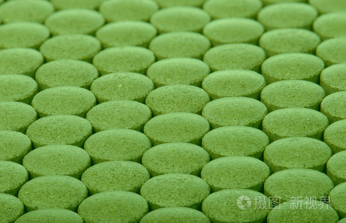 特写背景的绿色药丸