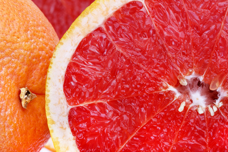 葡萄柚养乐多新鲜红葡萄柚切片特写,水果背景照片