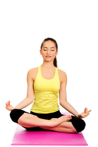 盘腿打坐打坐姿势莲花的女人照片