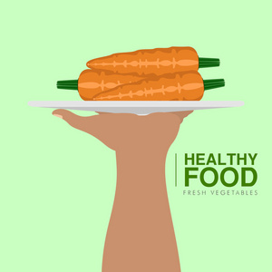 手捧胡萝卜。健康食品概念