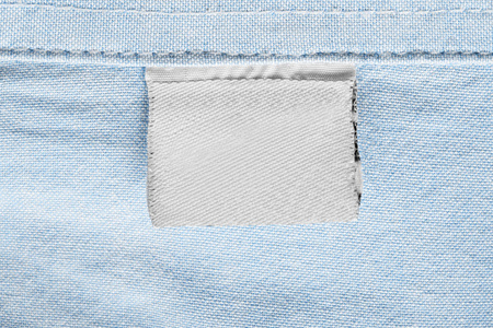 蓝色棉花背景空白纺织品白色衣裳标签