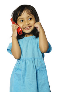 小女孩拿红色无线电话机图片