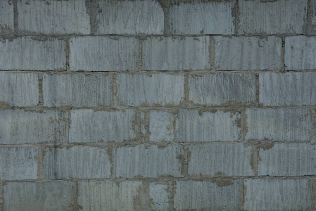 建筑墙砖中的灰石背景
