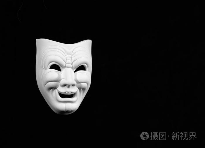 剧院面具expresing喜剧白色面具在黑背景与自由空间为文本