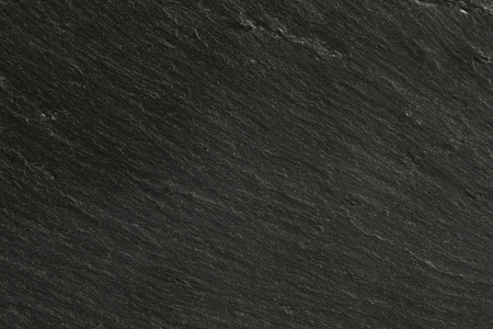 瓦楞纸板岩特写质地的黑色板岩照片