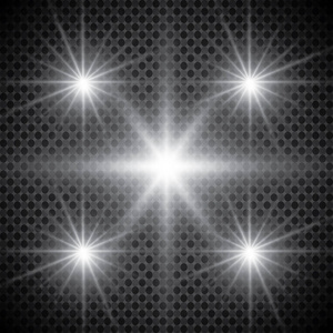 太阳闪烁着光芒,聚光灯.光的发光效果.闪闪发光的星芒照片