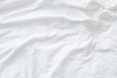 白色床上用品床单或白色织物防皱纹理背景 软焦点