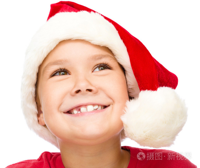 小女孩在圣诞老人的帽子做白日梦