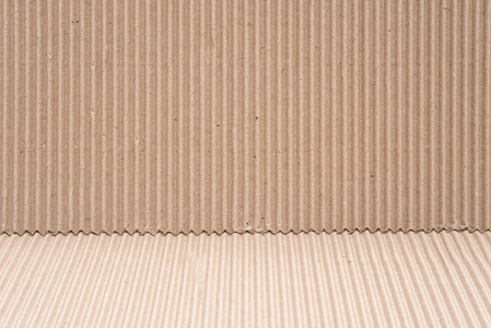 在两个不同角度的纸板波纹的图案照片