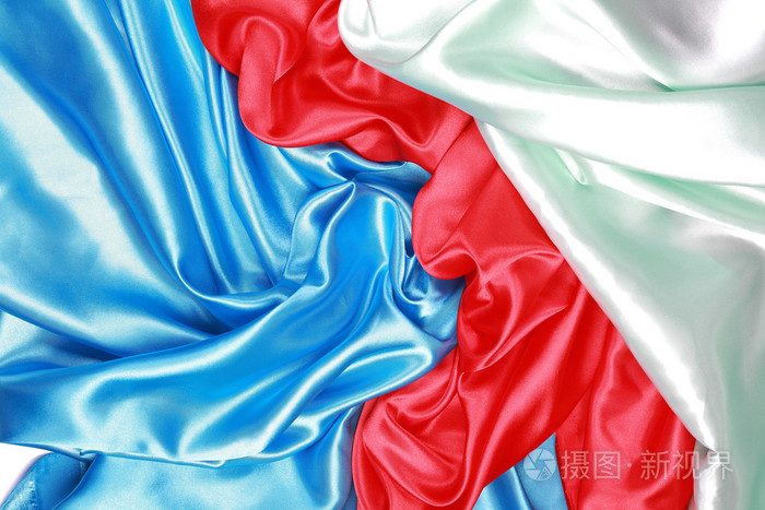 蓝色和红色和浅绿色的丝绸布的抽象背景