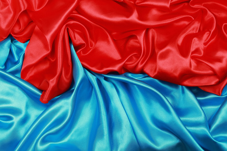 蓝色和红色丝绸布的抽象背景
