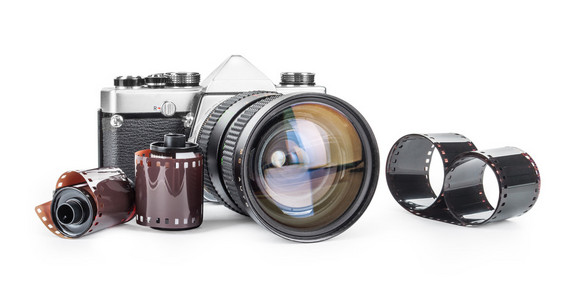 老式照相机老式照相机和胶卷孤立在白色背景上照片