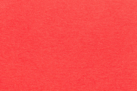老亮的红纸特写的纹理.结构的致密的纸板.胭脂红背景照片