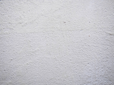微距背景图片腻子的纹理.白墙身涂渍和滴在一个表面的特写镜头.