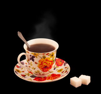 一杯热茶与两勺的糖图片