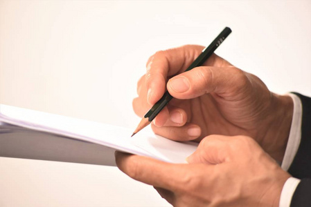 三峡大坝手写字用铅笔写字的手照片