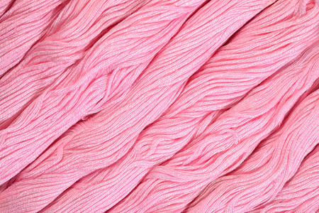 牙线作为背景纹理的粉红色 skeins