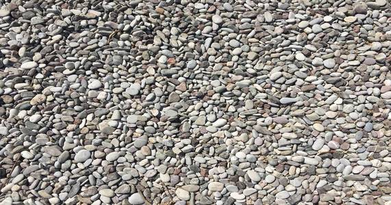 卵石石材纹理灰色鹅卵石石材的质感和背景.