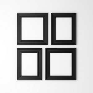 白墙上四个空白黑色相框