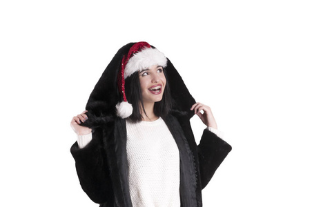女孩在大括号圣诞老人帽子隔离毛皮大衣