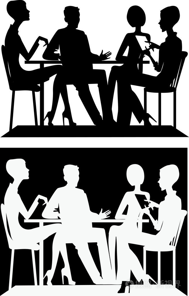 一群人坐在一张桌子的剪影