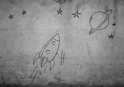 飞行在水泥墙上的画的火箭