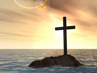 基督教的十字架,在大海中的岩石上照片