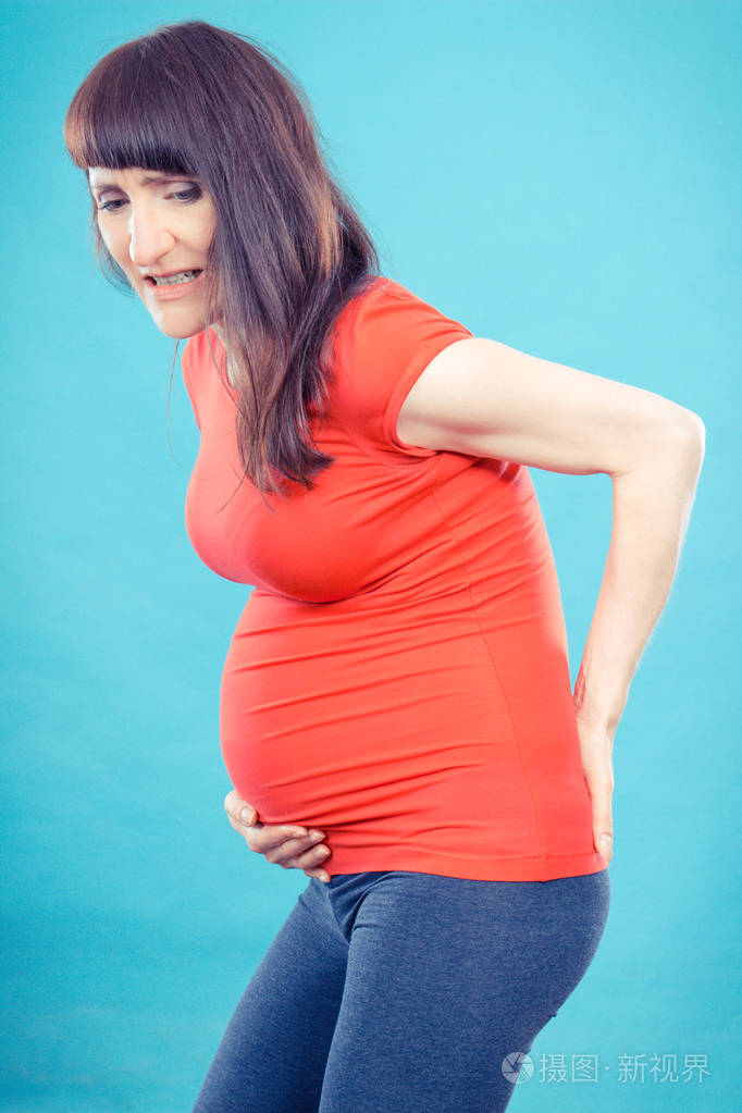 孕妇的腹部或背部疼痛卫生保健和妊娠的疼痛的概念