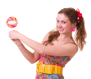 粉色螺旋棒棒糖的漂亮年轻女孩图片