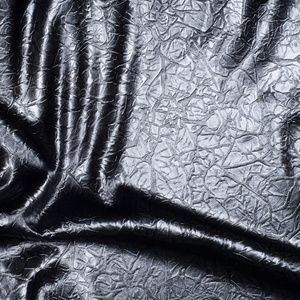 织物纹理的丝印黑色。有灰色斑点。抽象