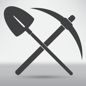 铲料锄头和铲子符号照片