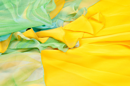 丝绸面料质地, 背景。绿色和黄色颜色