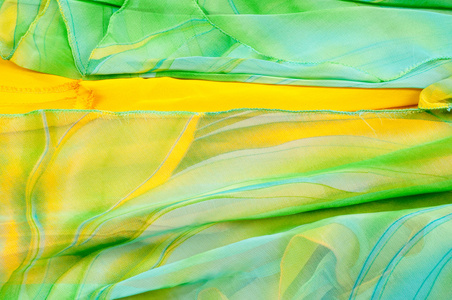 丝绸面料质地, 背景。绿色和黄色颜色