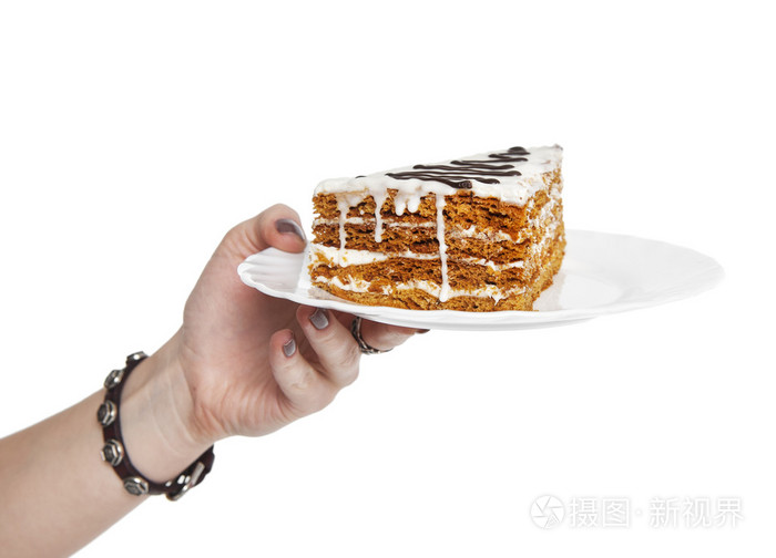 手拿着一块蛋糕孤立