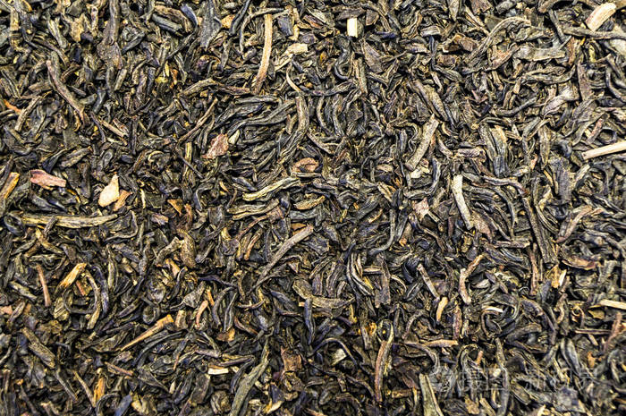 纹理的茶散落在桌子的表面照片-正版商用图片0cypa9-摄图新视界