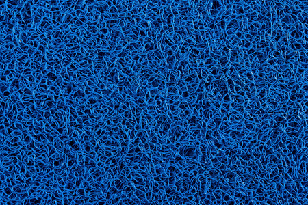 蓝色地毯背景蓝色塑料门垫纹理和背板