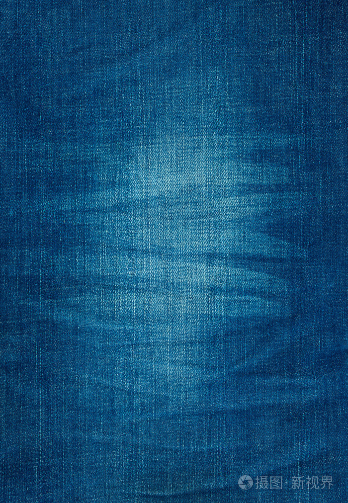 蓝色牛仔裤的背景纹理与褶皱和磨损