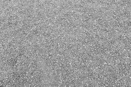 表面的灰色的砂砾路背景图片