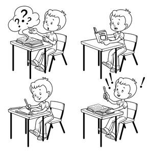 可爱的小学生在学校桌子后面.照片