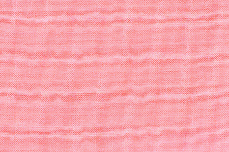 从一种纺织材料用柳条图案，特写浅粉色背景